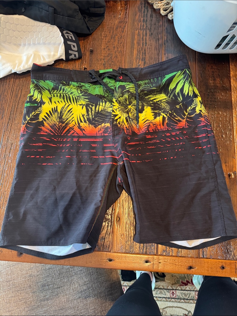 surf style Black Swim Board Shorts with Green, Yellow & Red Tropical Print